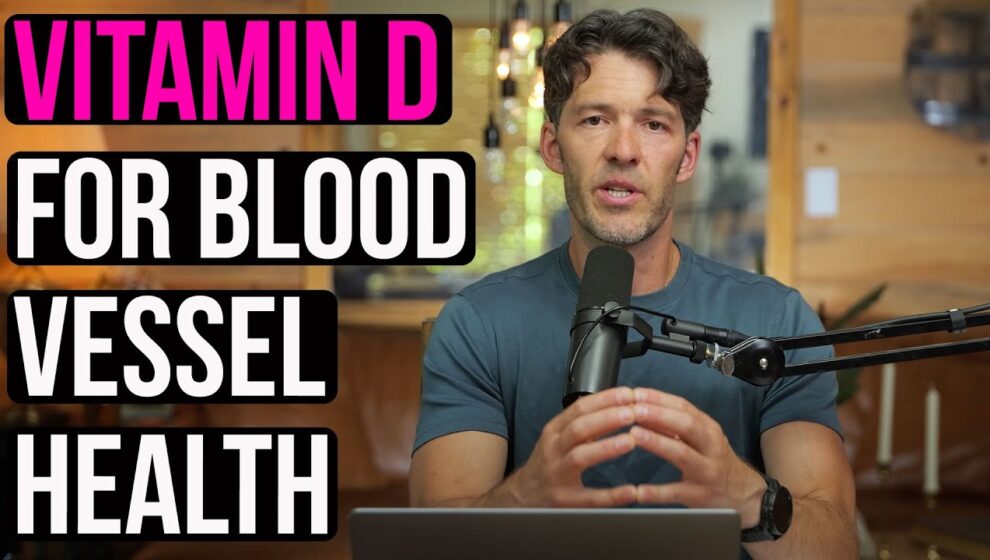 Mike Mutzel speaks into a microphone. Written along the left side of the page is "Vitamin D for Blood Vessel Health."